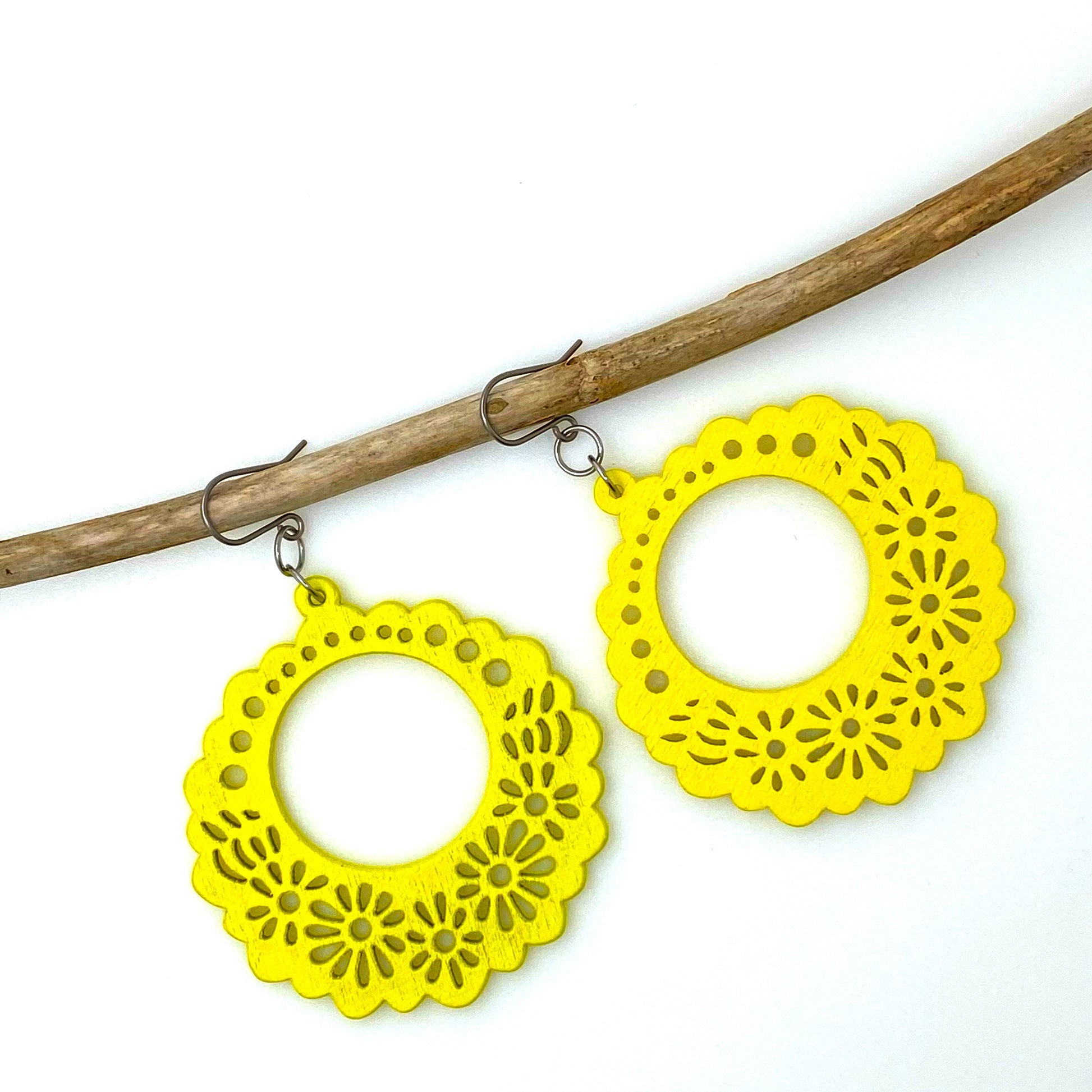 Wooden Floral earrings on a white background. yellow