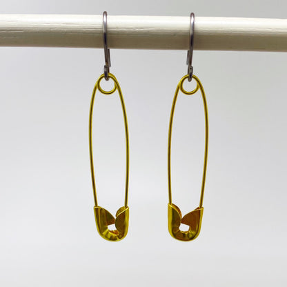 SafetyPin earrings with a titanium hook on a white background