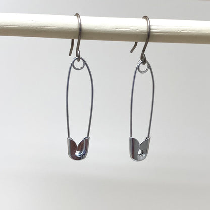 SafetyPin earrings with a titanium hook on a white background